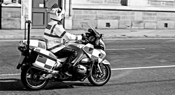 Police motorcycle rolling roadblock